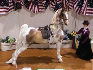 This model horse nicely shows absolute elevation, with an upright next, dropped shoulders and back, and outwardly turned hind end. 