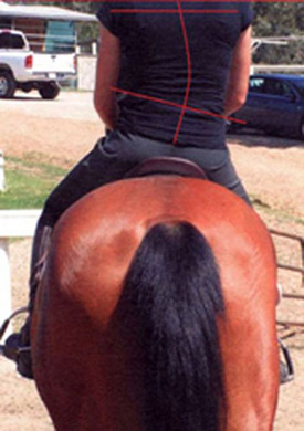 A crooked rider resulting from the saddle slipping.